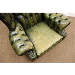  Vintage Chesterfield club chair upholstered in deep buttoned green leather, W94cm  