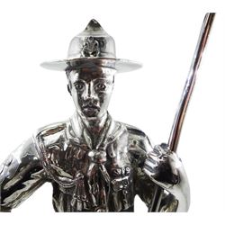 1930's silver model of an American boy scout, in full uniform, with one foot raised upon rocky modelled ground, hallmarked Gladwin Ltd, Sheffield 1930, upon an ebonised circular base, overall H31cm 