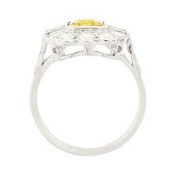 Platinum yellow sapphire and diamond milgrain set cluster ring, single octagonal cut sapphire of approx 2.20 carat, surrounded by two baguette cut diamonds and ten transitional cut diamonds and diamond set shoulders, stamped Plat, total diamond weight approx 0.95 carat