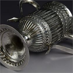 George III silver twin handled trophy cup, of typical form with twin C scroll handles and upon a domed circular foot, the body with repousse and chased fluting and C scroll decoration, with later presentation engraving to cartouche, hallmarked London 1803, maker's mark slightly rubbed but probably for Peter, Ann and William Bateman, H16cm