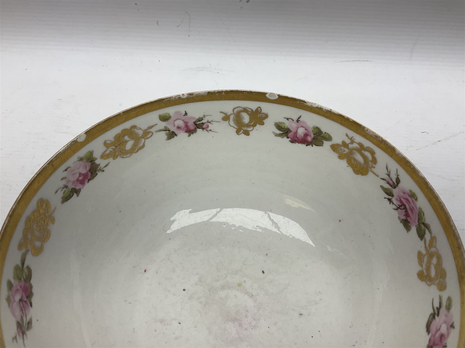 Group of 18th and 19th century ceramics for repair and restoration, to include an 18th century Derby figure emblematic of the Continent of Africa, pair of small 19th century Derby vases, painted with birds and floral spray, 19th century Derby slop bowl decorated in the 594 pattern with pink roses against gilt trellis, 19th century Derby figure of a recumbent deer, Serves style box, and two further figures