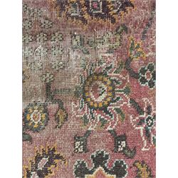 Belgian Sultan woollen ground rug, central navy field densely decorated with floral sprays and geometric patterns (192cm x 135cm); handwoven tribal terracotta ground rug (121cm x 71cm); Persian crimson ground runner, all over stylised floral and foliate motifs (266cm x 94cm)