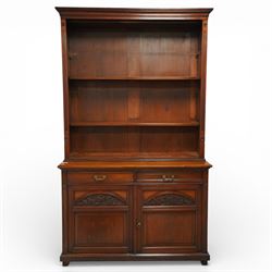 Late Victorian tall walnut open bookcase on cupboard, projecting cavetto cornice over reed...