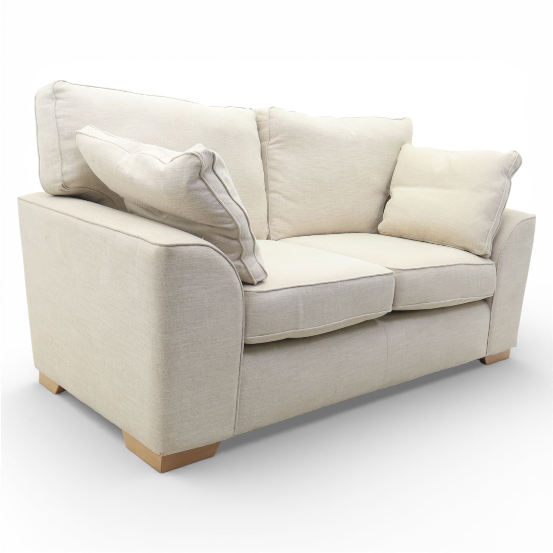 Next Home - Contemporary two seat sofa, square back and arms, upholstered throughout in beige fabric, fitted with two loose seat cushions and two loose back cushions, with arm cushions, raised on block wooden feet