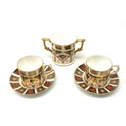 A pair of Royal Crown Derby Imari 1128 coffee cans and saucers, together with a Royal Crown Derby Imari 1128 loving cup, each with marks beneath. 