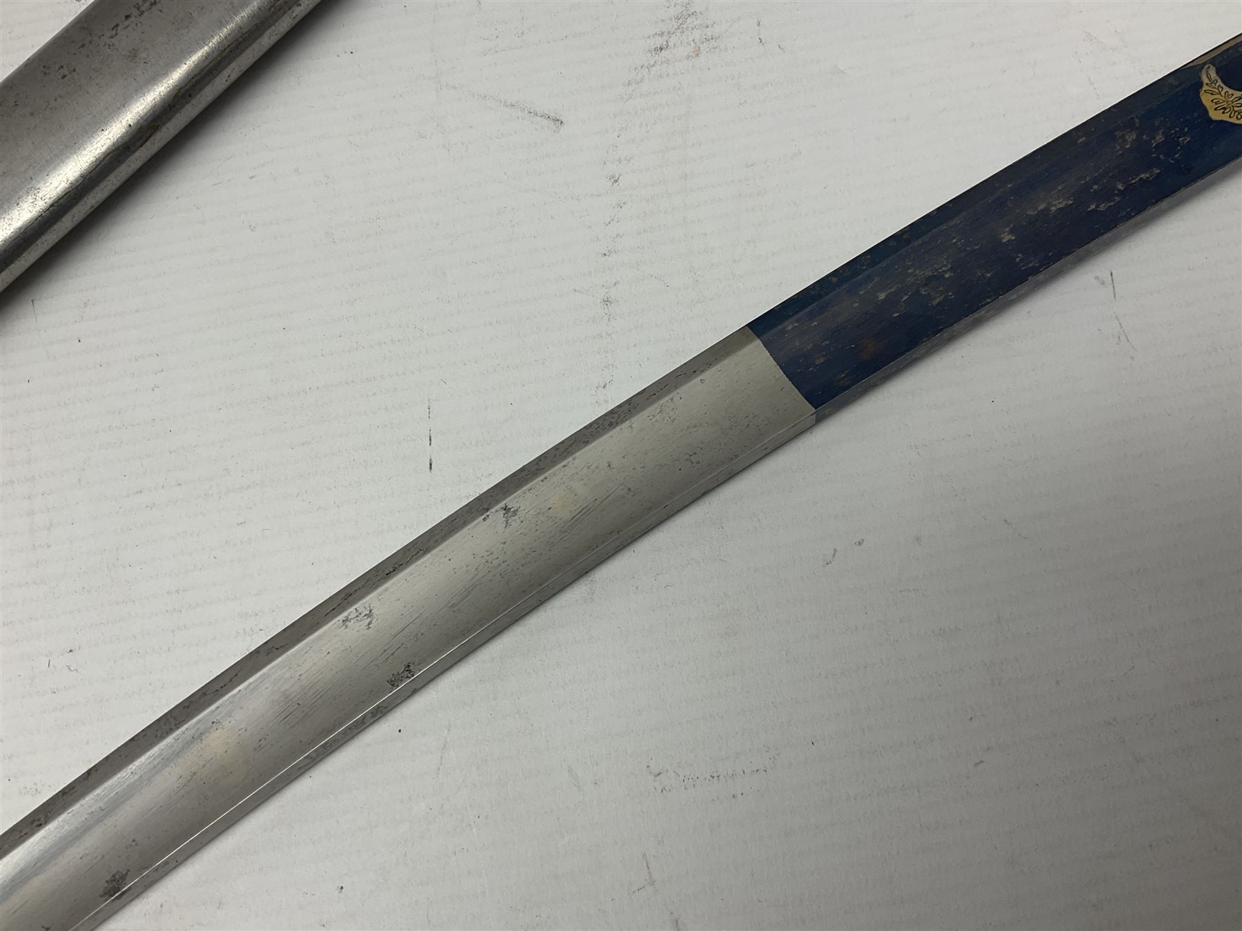 Early 19th century French Lancers officer's sword c1810, the 84cm curving fullered blade retaining most of its bluing, gilding and engraved decoration, inscribed I.S.& C. to ricasso (for Schimelbusch), brass three-bar hilt with elongated elliptical langets and wire-bound leather grip; in polished steel scabbard with two brass suspension rings L100cm overall