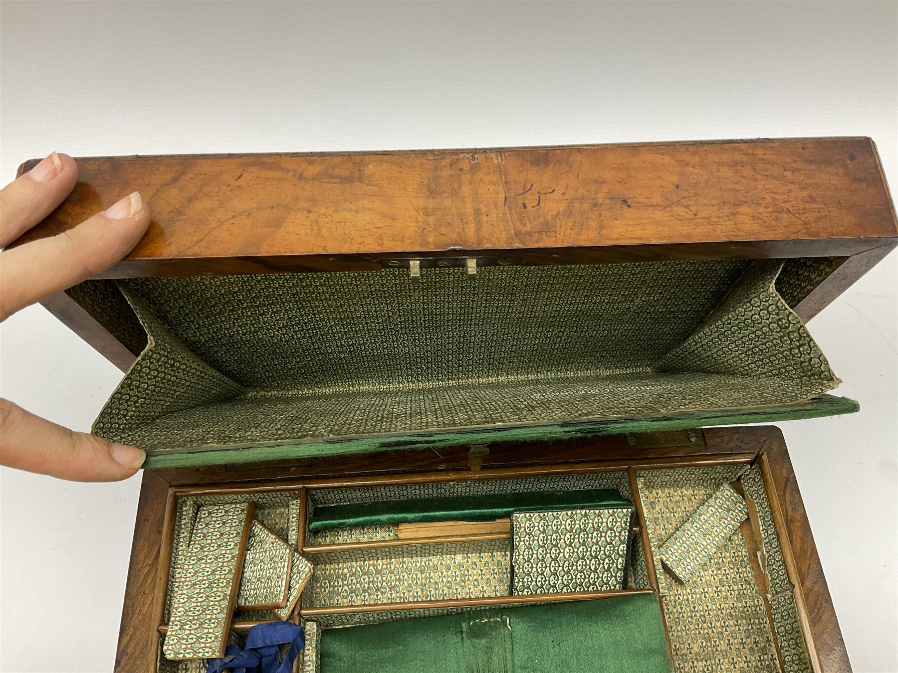 Victorian walnut sewing box, the hinged lid decorated with inlaid backgammon and cribbage board lifting to reveal lined compartmented interior with lift out tray
