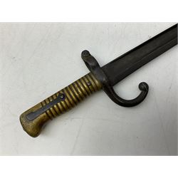 French Model 1866 sabre bayonet with 57cm fullered steel curving blade; in steel scabbard L71cm overall; another Model 1866 sabre bayonet lacking scabbard; and British Pattern 1856 sword bayonet (no scabbard) (3)