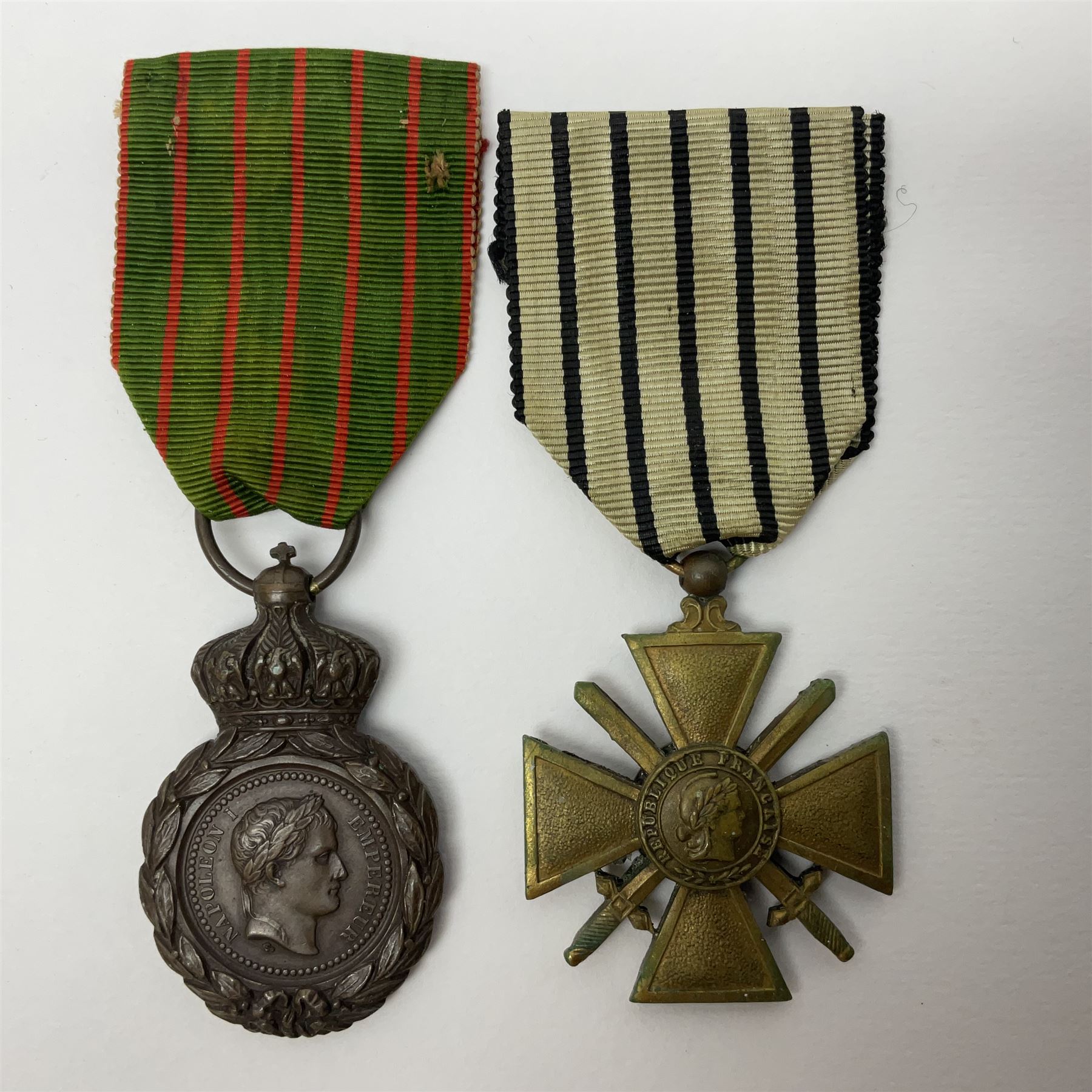 Four French medals - St. Helena medal with bust of Napoleon to obverse and inscription to reverse 'Campagnes de 1792 a 1815. A ses compagnons de gloire sa derniere pensée Ste. Hélène 5 Mai 1821', established by Emperor Napoleon III in 1857; two WW2 Croix-de-Guerre; and WW2 Croix-du-Combattant; all with ribbons (4)