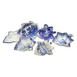 Six late 18th/early 19th century blue and white printed pickle dishes, to include two Wedgwood examples decorated with berries, each with impressed mark beneath, a Spode example decorated in the Italian pattern, with printed marks beneath, and two examples decorated in variations of the Willow pattern, one with collectors label beneath detailed 'Leeds' 
