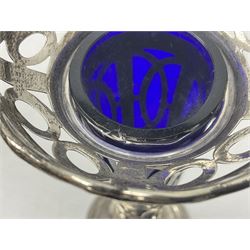 20th century silver specimen vase, of pierced trumpet form with flared rim, filled base, and blue glass liner, hallmarked Birmingham 