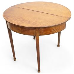 George III satinwood demi-lune tea table, fold-over top over double-gate leg action base, the central frieze rails and support headers inlaid with floral marquetry panels, on square tapering supports and block feet 
