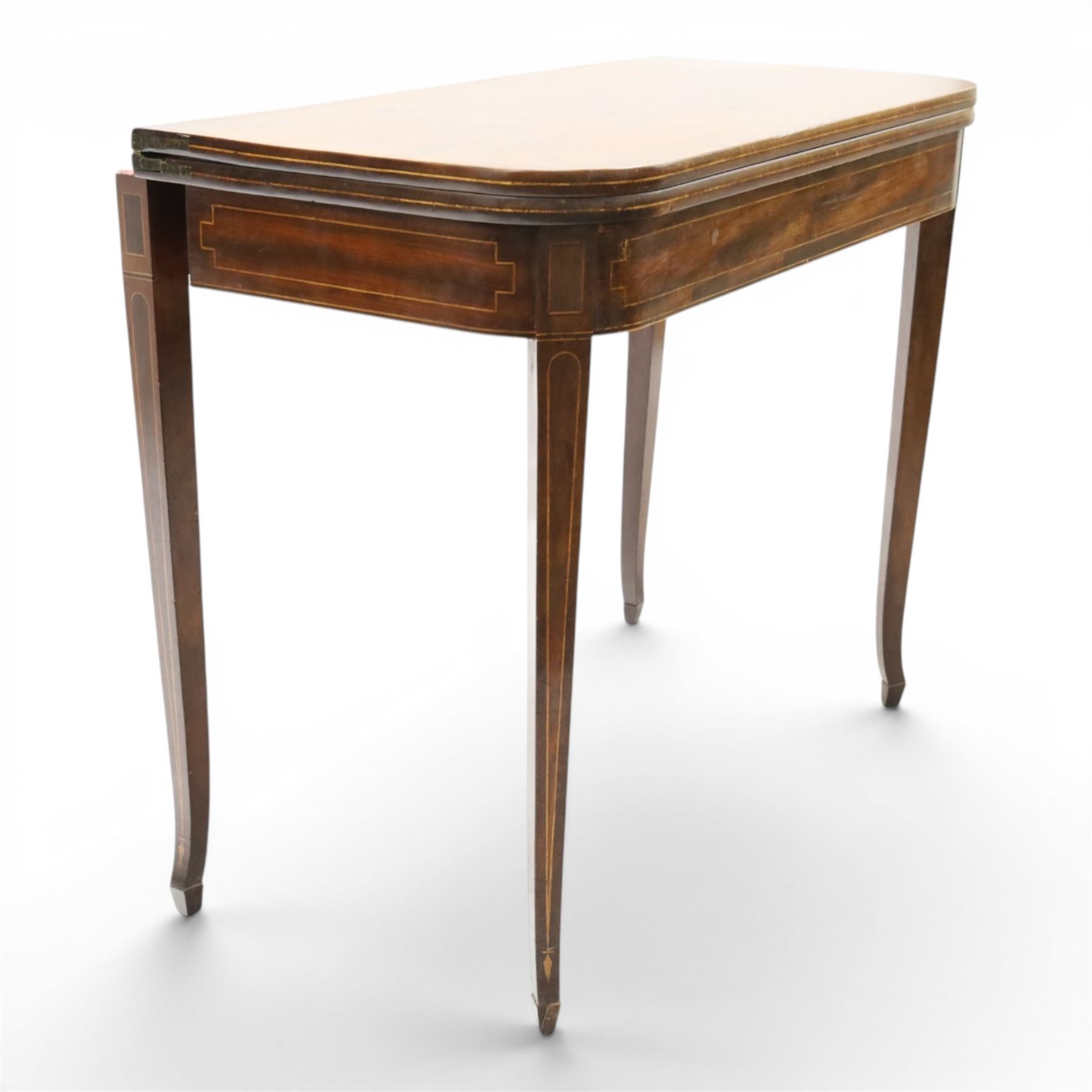 George III mahogany tea-table, the D-shaped rectangular fold-over top with satinwood stringing, raised on elegant square tapering and splayed supports with spade feet and gate-leg action