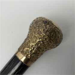 Malacca walking cane mounted with continental silver cap, embossed with landscape scene, together with a ebonised wooden walking cane, mounted with an 18ct gold plated cap, embossed with scrolls, tallest H89cm