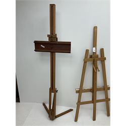 A group of four artist's easels, largest example H150cm. 