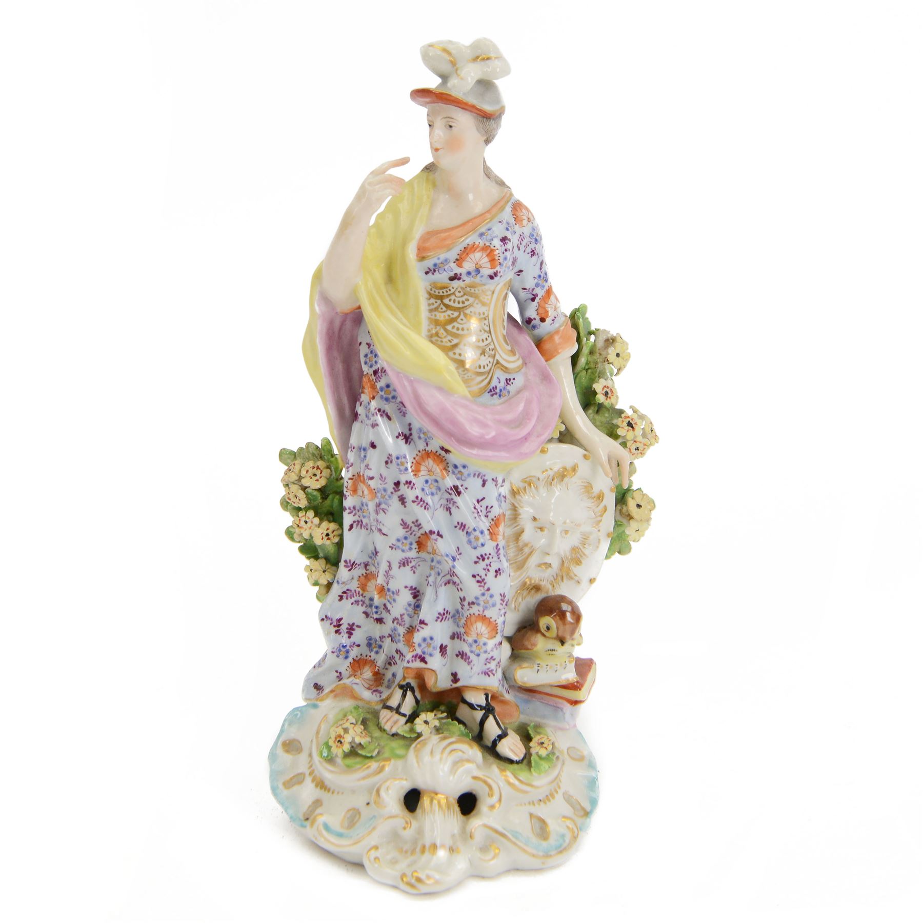 18th century Derby porcelain figure, circa 1775, modelled as Minerva, standing with mask shield, books and owl, against flowering bocage, upon a scroll base encrusted with flowers, H23cm