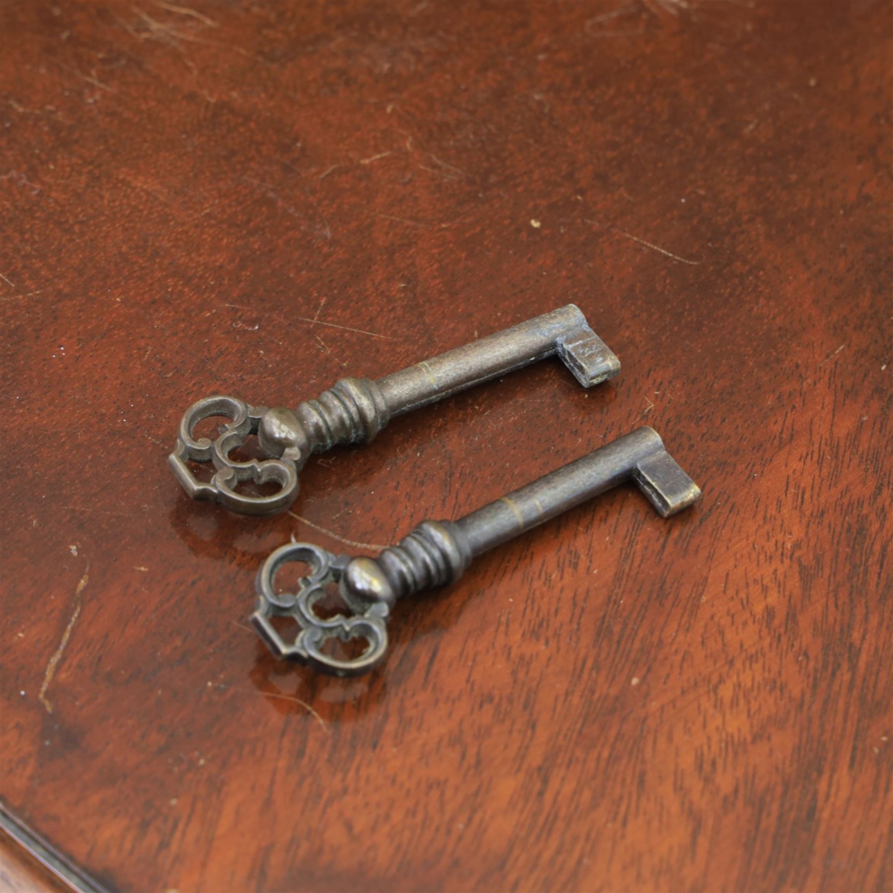 Reprodux - Georgian design pair of mahogany bow-front cabinets, moulded lifting hinged top, above a locking cabinet with drawer below, raised on bracket feet 