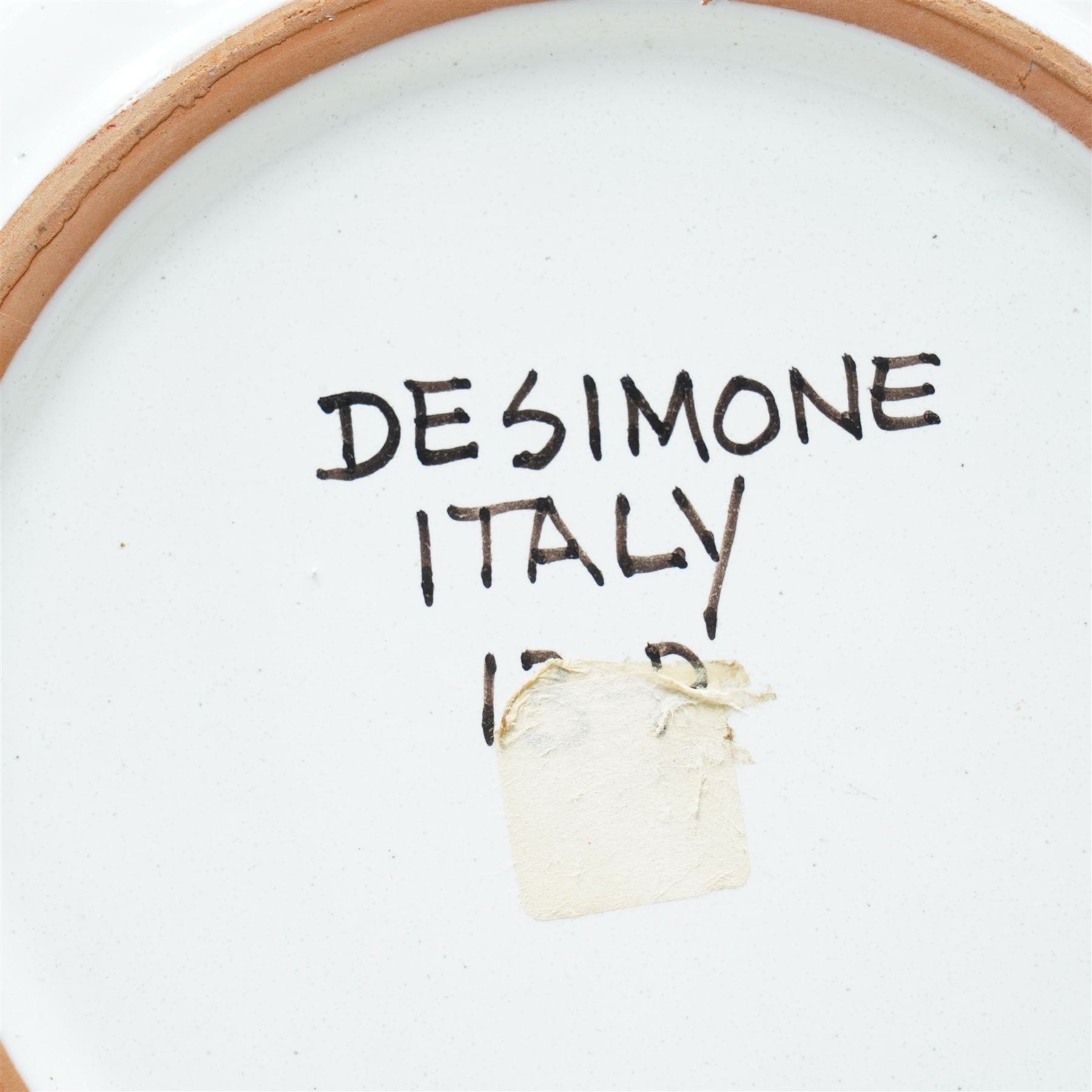 Giovanni DeSimone - two hand-painted mid-century plates, each incised and polychrome enamelled, signed to the front , larger plate D25cm