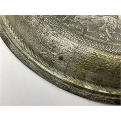 Eastern tin charger, decorated with a central circular panel in low relief of figures and deer, within a hammered border, D41cm