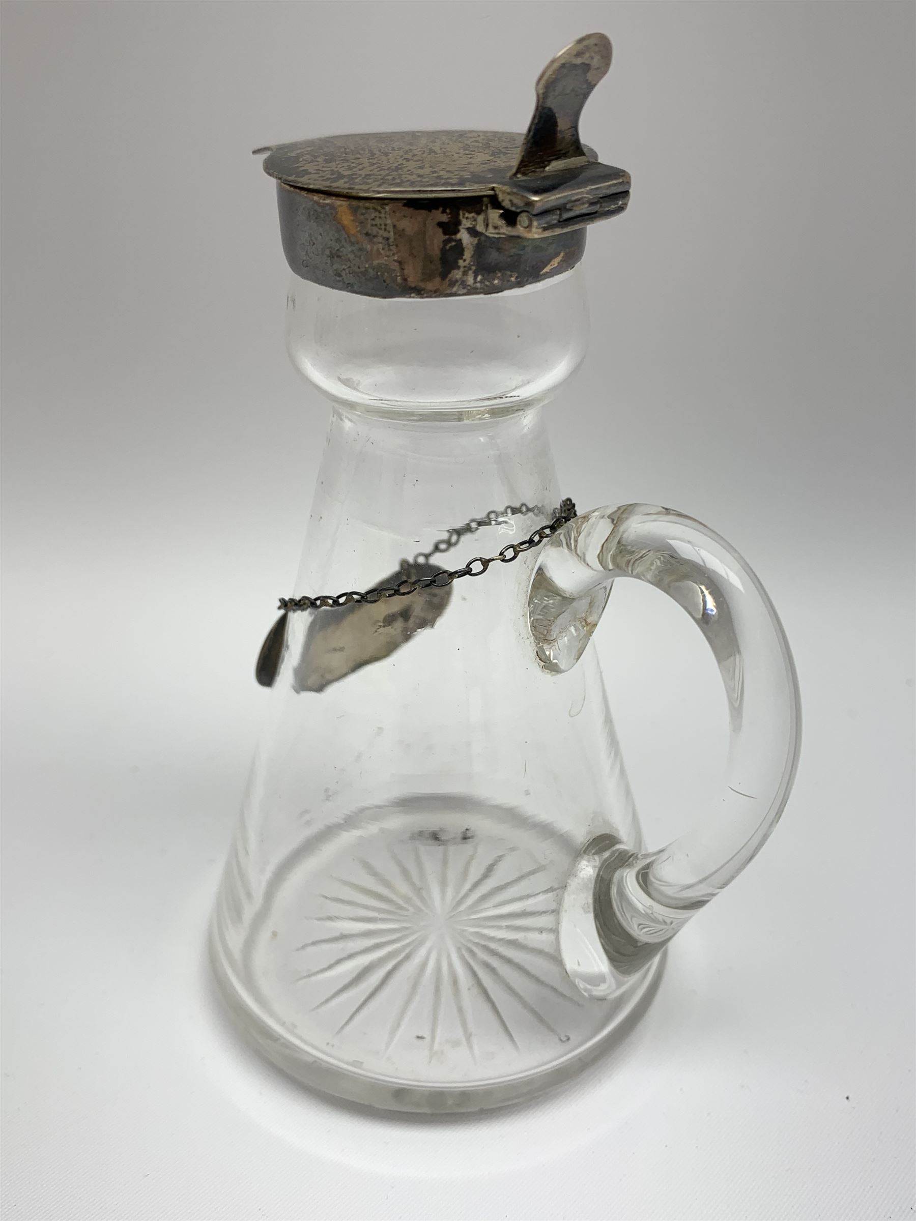 Edwardian silver mounted whisky noggin, of tapering cylindrical form with hinged flat cover, H12cm, together with a silver whisky label, each hallmarked H B Johnson & Co, London, whisky noggin dated 1906, label 1910