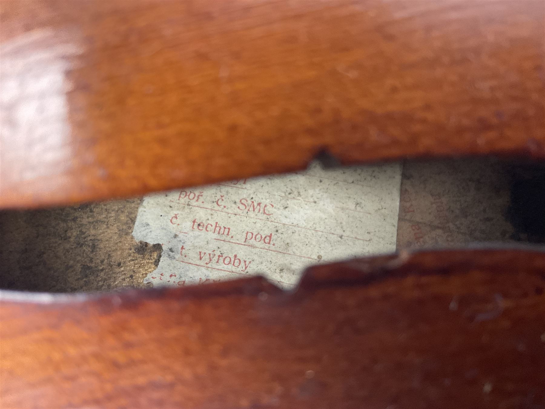 Saxony (?) violin c1950 with 36cm two-piece maple back and ribs and spruce top; bears label 'The Maidstone School Orchestra Association' L59cm overall; and 1950s Czechoslovakian violin for restoration; both in carrying cases (2)