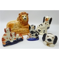  Staffordshire ceramics comprising large model of a Lion with glass eyes, L27cm, Spaniel, pen holder modelled as a family of Spaniels, money box and one other  