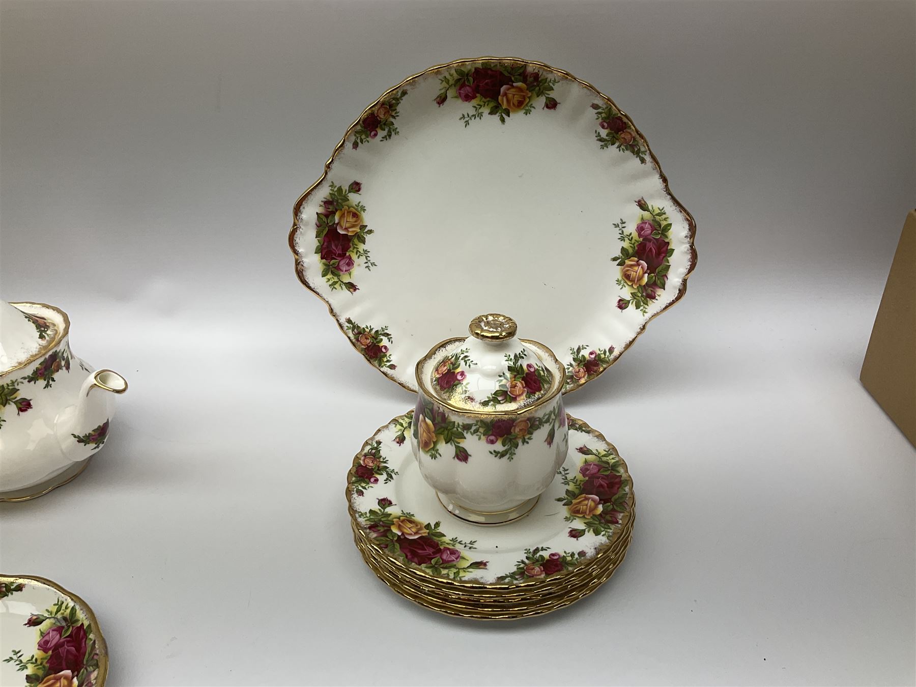 Royal Albert Old Country Roses pattern tea set, comprising teapot, coffee pot, six teacups and six saucers, five side plates, further teacup with joined saucer and side plate, open sucrier, milk jug, cake plate, and preserve pot and cover, together with Royal Albert Jubilee Rose pattern sauce boat and stand, and Royal Albert Lavender Rose pattern cake stand. 