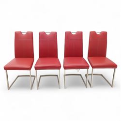 Set of seven contemporary style dining chairs, each with a high padded back and seat upholstered in faux leather on brushed steel sled bases  