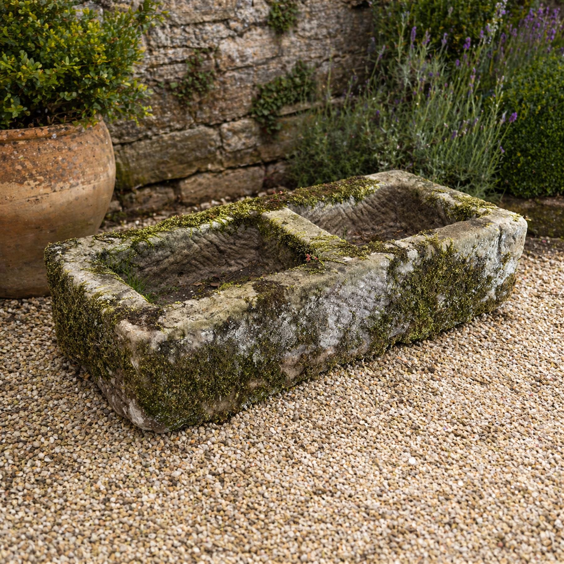 19th century weathered hewn stone double trough rectangular form with two divisions