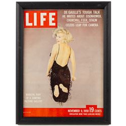 Marilyn Monroe - two European film posters, comprising The Seven Year Itch (7 ans de reflexion), French poster after the 1955 film starring Marilyn Monroe and Tom Ewell, linen backed, 81 x 61cm and Let's Make Love (El Multimillonario), framed and glazed Spanish poster after the 1960 film, starring Marilyn Monroe and Yves Montand, 100 x 70cm, together with a framed Life Magazine newstand poster featuring Marilyn as the cover star and a Life book 'Remembering Marilyn