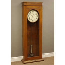  20th century IBM Model 13-7 Electric slave clock, No.15255, circular white Arabic dial with subsidiary seconds, in oak case with glazed door, chromed pendulum, H160cm, W52cm, D25cm  