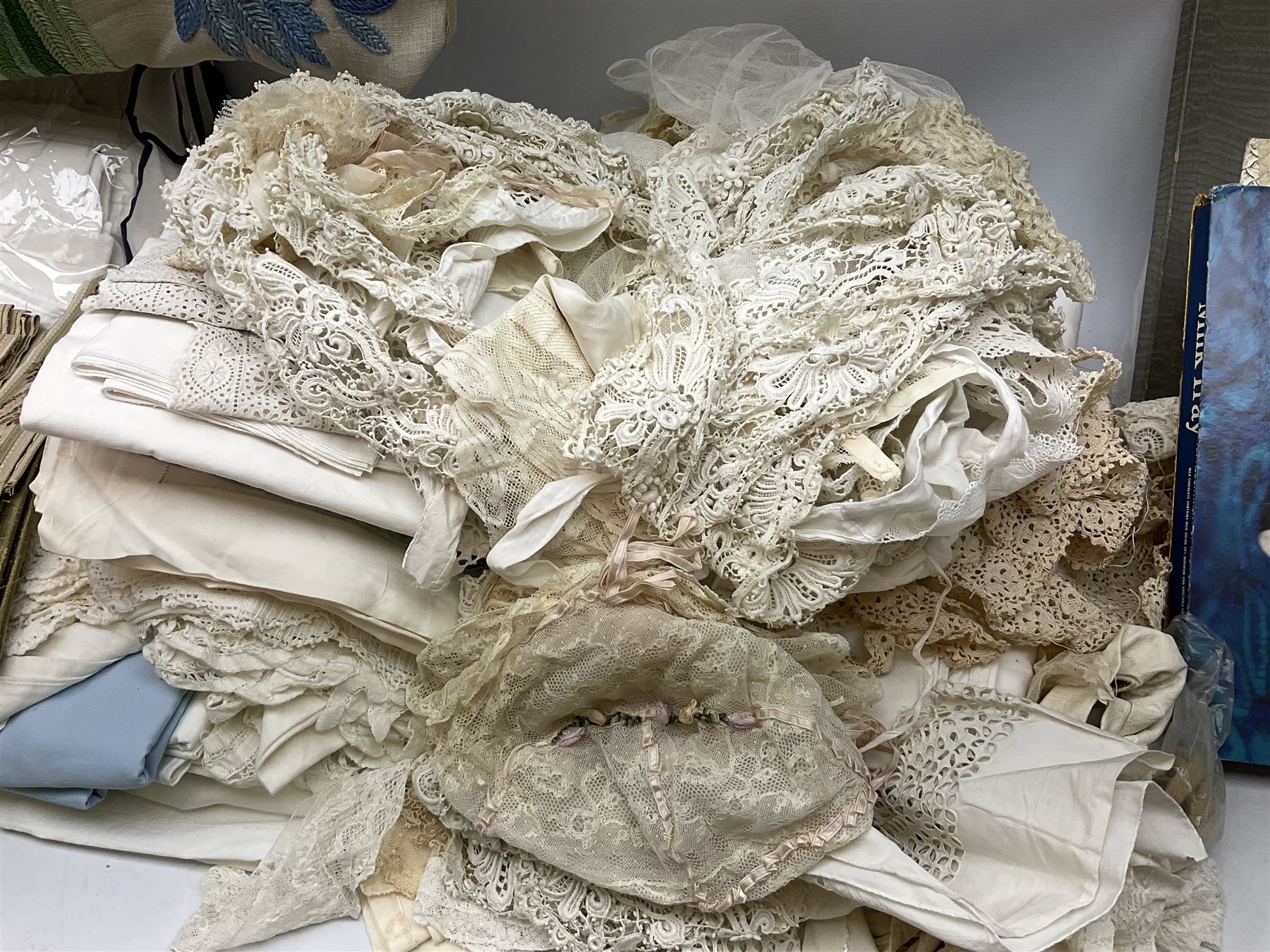 Large quantity of table linen and Victorian and later lace, framed machine tapestry depicting Greece, embroidered wall hanging decorated with a woodland scene with deer and blossoming tree, embroidered linen decorated with floral design, crochet, etc