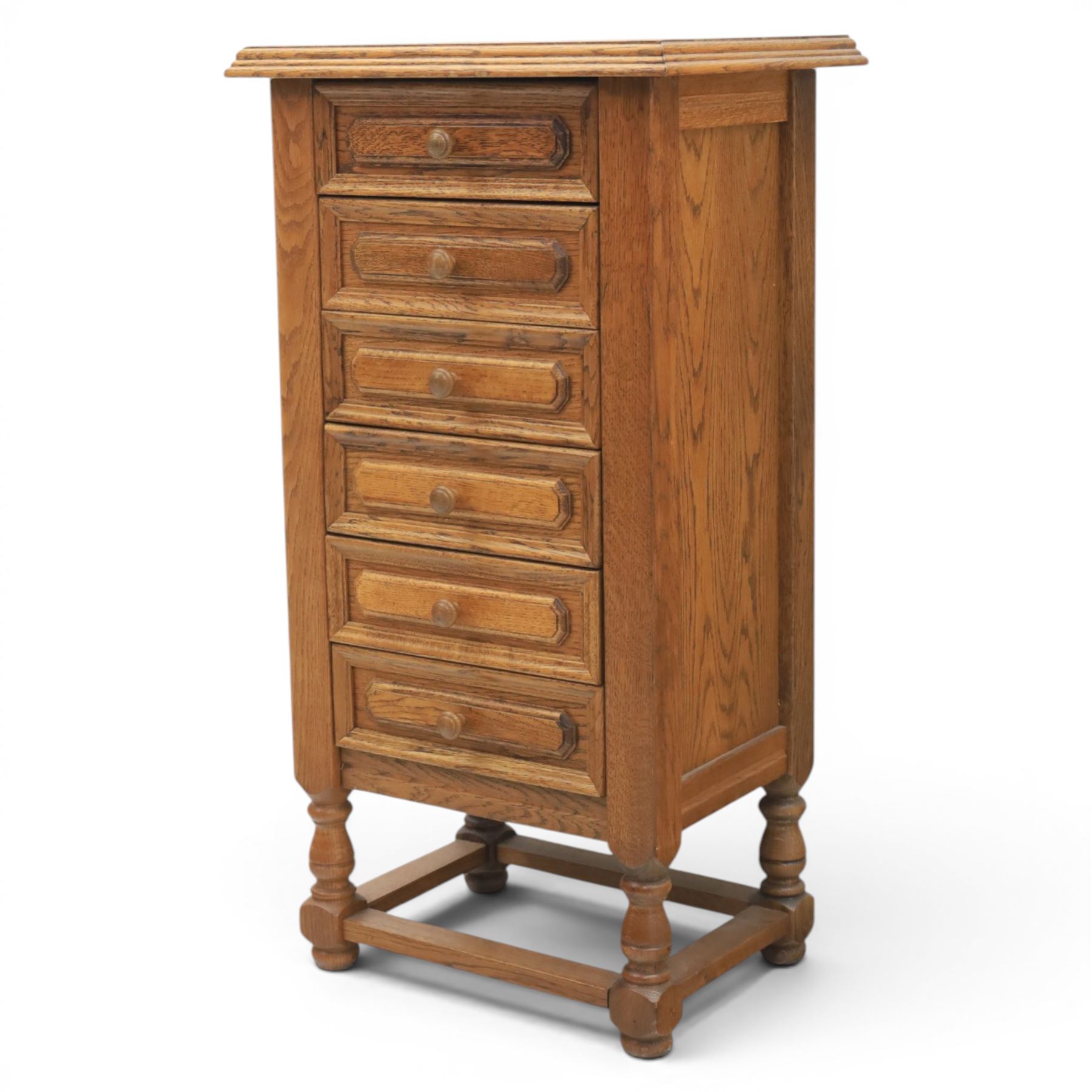 Early 20th century oak pedestal chest, with six drawers with moulded edges, raised on turned supports united by a stretcher 