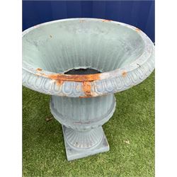 Pair cast iron Campana shaped urns, egg and dart moulded rim, fluted body with gadroom underside, fluted foot support on square bases - THIS LOT IS TO BE COLLECTED BY APPOINTMENT FROM DUGGLEBY STORAGE, GREAT HILL, EASTFIELD, SCARBOROUGH, YO11 3TX