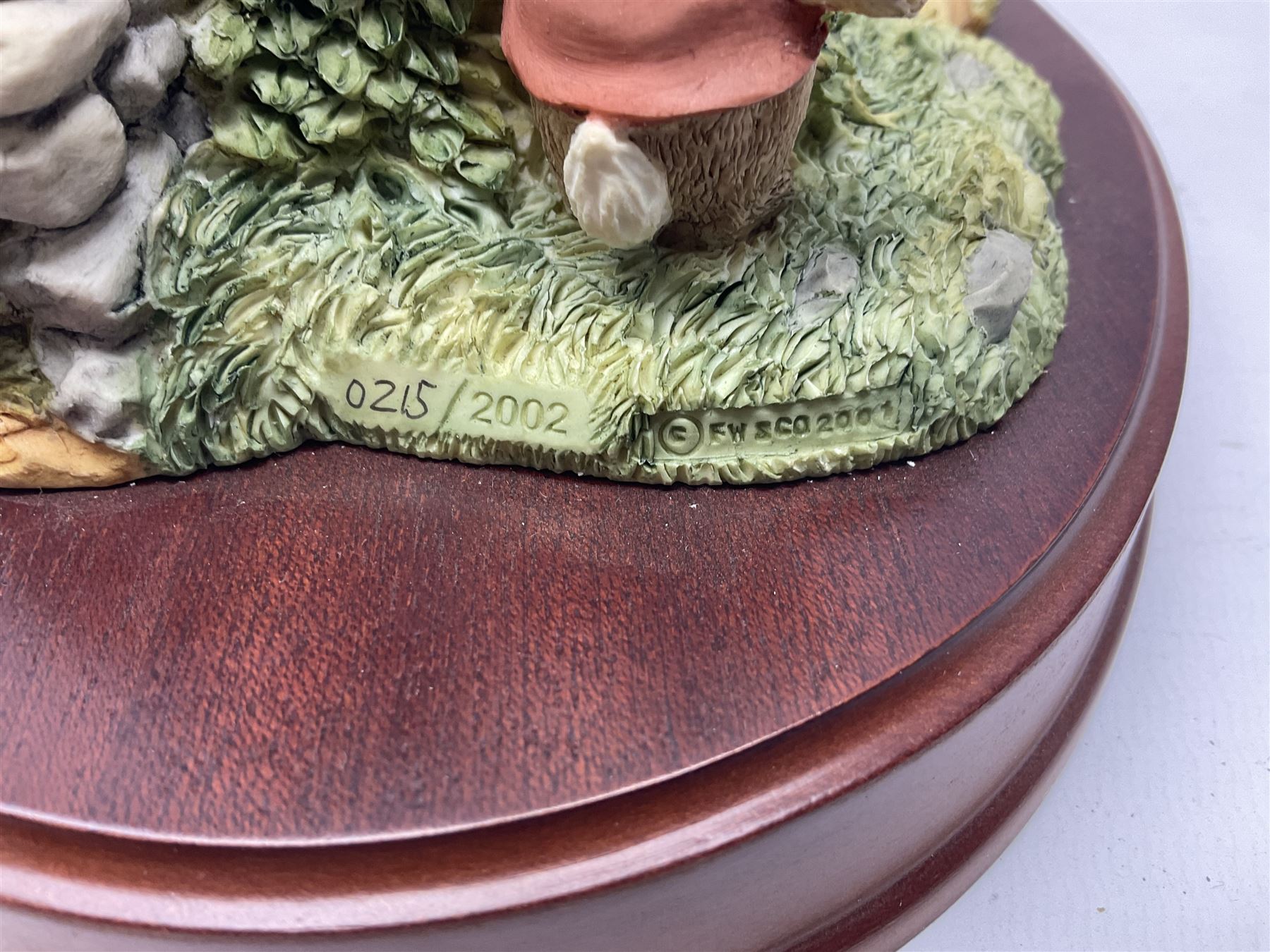 Four Border Fine Arts Beatrix Potter figures, comprising Tableau created to commemorate the Millenium together with a Border Fine Arts Limited Edition no 669814, The Tale of Peter Rabbit Tablet A1306, Four Little Rabbits A2442 and Sailing Home A2443