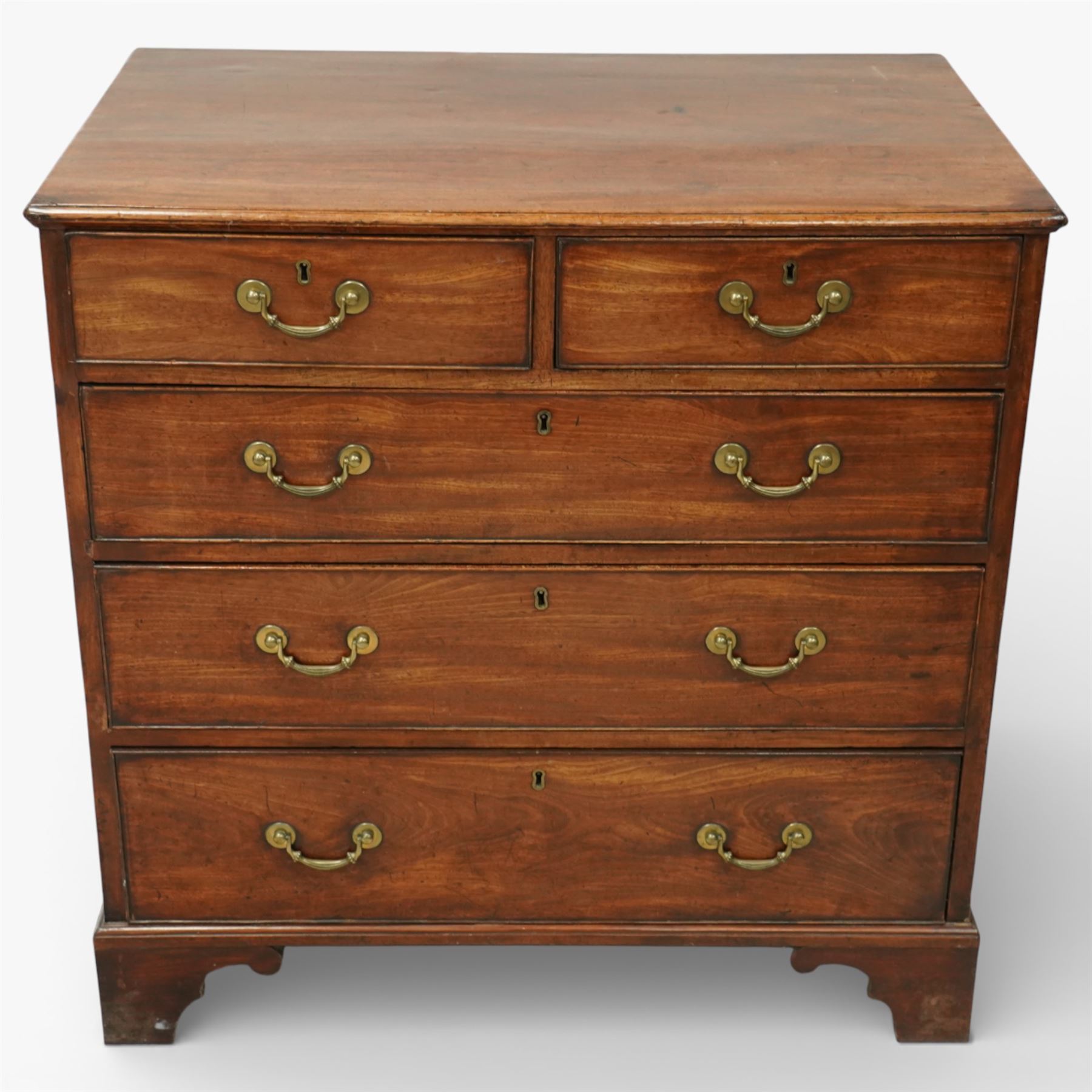 George III mahogany chest of drawers, moulded rectangular top over two short and three long drawers, plain frieze, the drawers fitted with brass swan neck handles and pierced escutcheons, raised on shaped bracket feet
