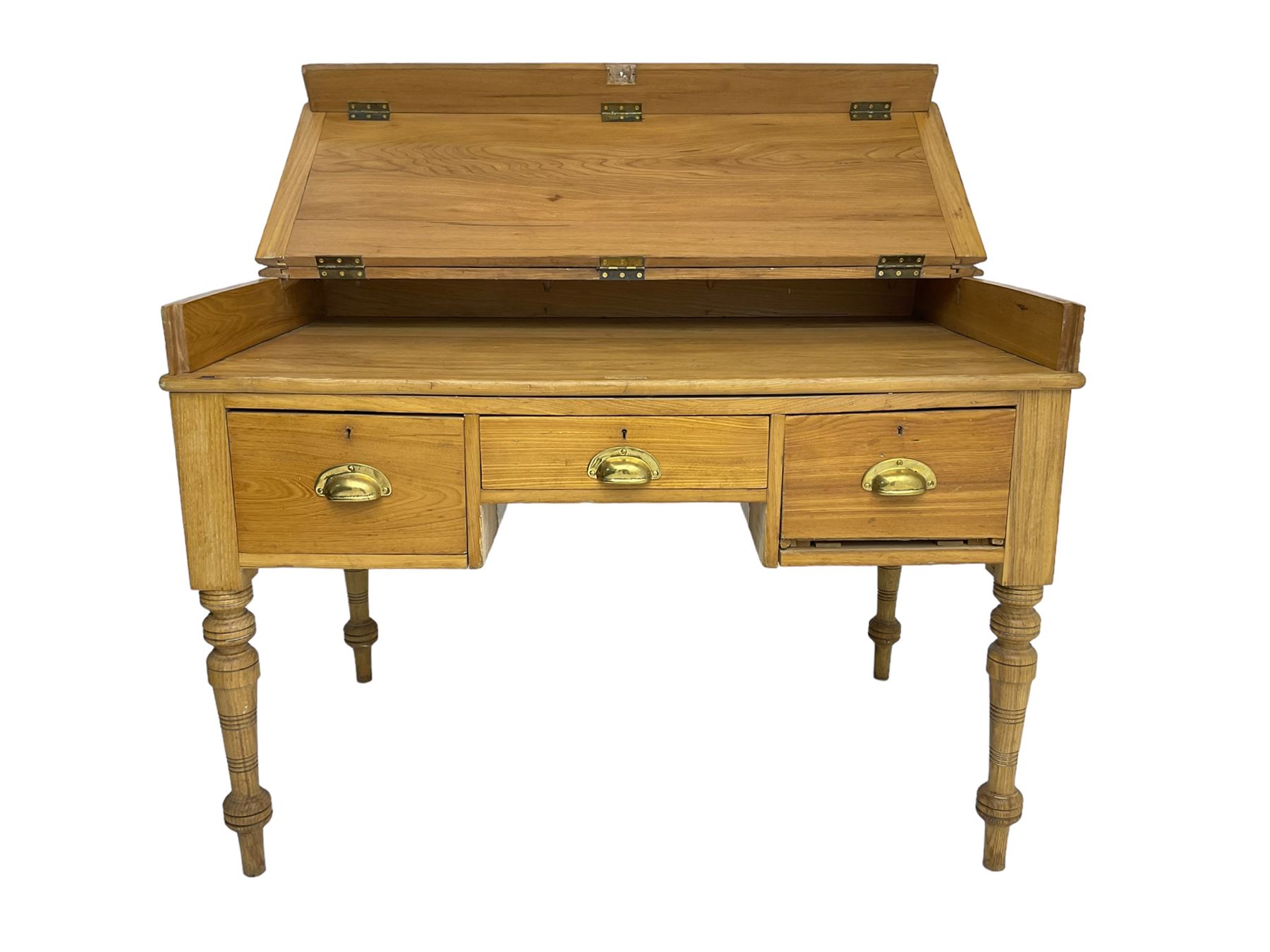 Early 20th century light oak kneehole desk, rectangular hinged top, fitted with frieze drawer flanked by two deep drawers, raised on ring turned supports
