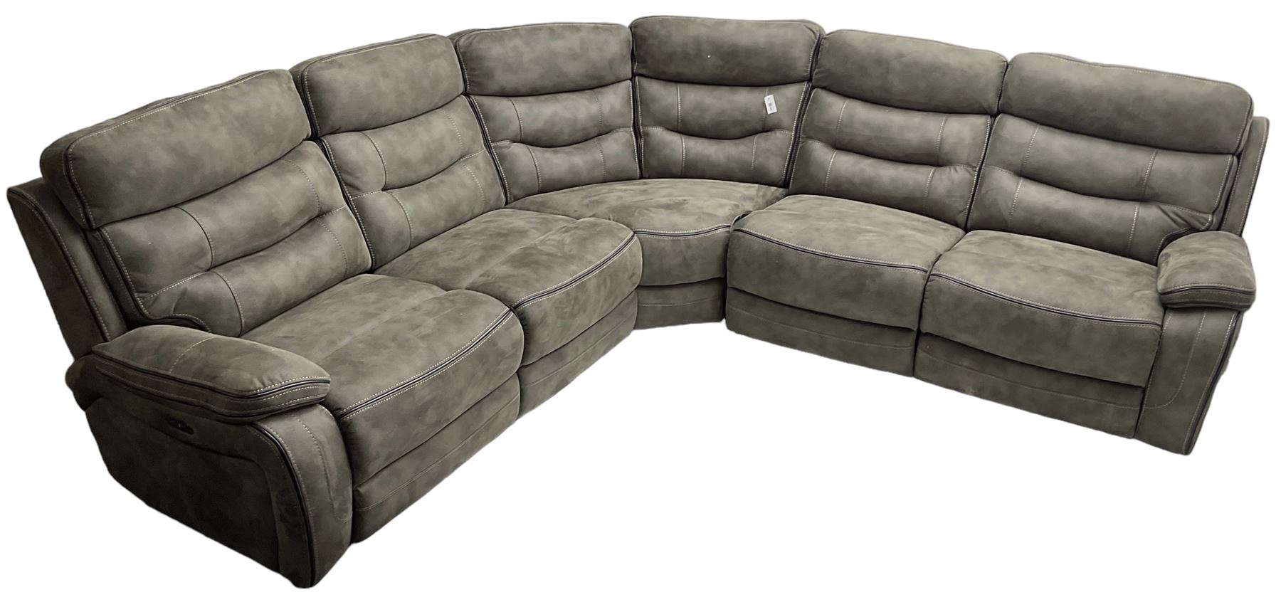 Large contemporary reclining corner sofa, upholstered in gunmetal grey faux suede fabric with black piping