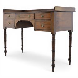 Late Georgian mahogany sideboard, circa 1820, the rectangular top with gallery, above an arrangement of four drawers with brass ring handles, one double height drawer to the left, a central single frieze drawer, and two drawers to the right, upon turned legs