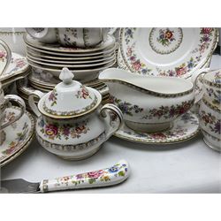 Extensive Royal Grafton Malvern pattern tea and dinner wares, comprising twelve dinner plates, six smaller plates, coffee pot, two teapots, two cake plates, eight teacups and ten saucers, six coffee cups and six saucers, two open sucriers, twin handled lidded sucrier, jug, lidded mustard pot and condiment jar, lidded tureen, two circular twin handled vegetable tureens, sauce boat and stand, oval and circular serving plates, salt and pepper shakers, breakfast cup and two saucers, further large cup and saucer, eighteen tea plates of various shapes, six side plates, six cereal bowls and six further bowls, shell dish and dish of square form, fork and knife, together with a hallmarked silver condiment spoon