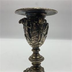 Pair of Victorian Elkington Mason & Co silver plated candlesticks, decorated in relief with ram masks and figures, H14cm