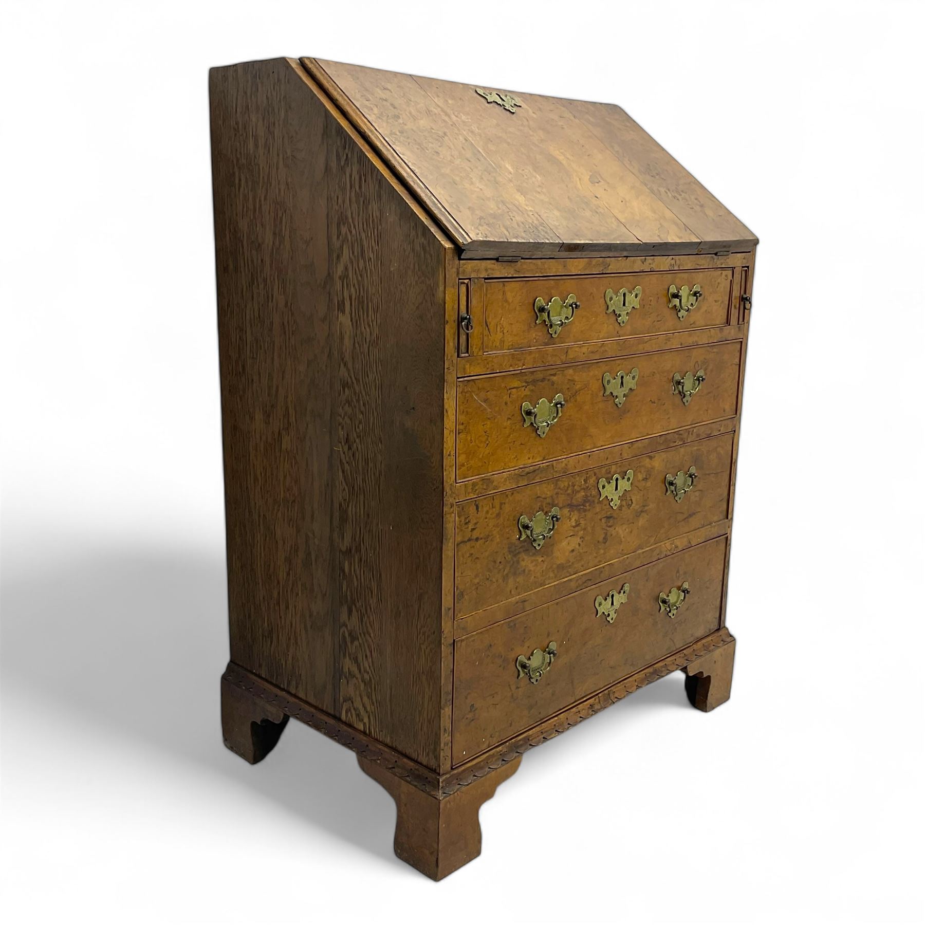 George III figured walnut bureau, fall-front enclosing central cupboard, six pigeonholes and six drawers, fitted with four graduated cockbeaded drawers, on bracket feet