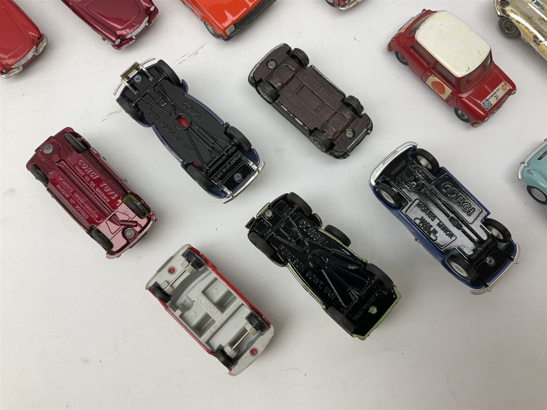 Corgi - thirty unboxed and playworn/repainted die-cast cars including Triumph Herald Coupe, BMC Mini-Cooper 'S', Porsche Carrera, two 'E' Type Jaguars, Rover 2000TC, three Morris Minors, two Aston Martin DB4, two Volvo P1800, MGA, Fiat 2100, Jaguar 2.4 Litre, Jaguar Mark X Saloon etc (30)
