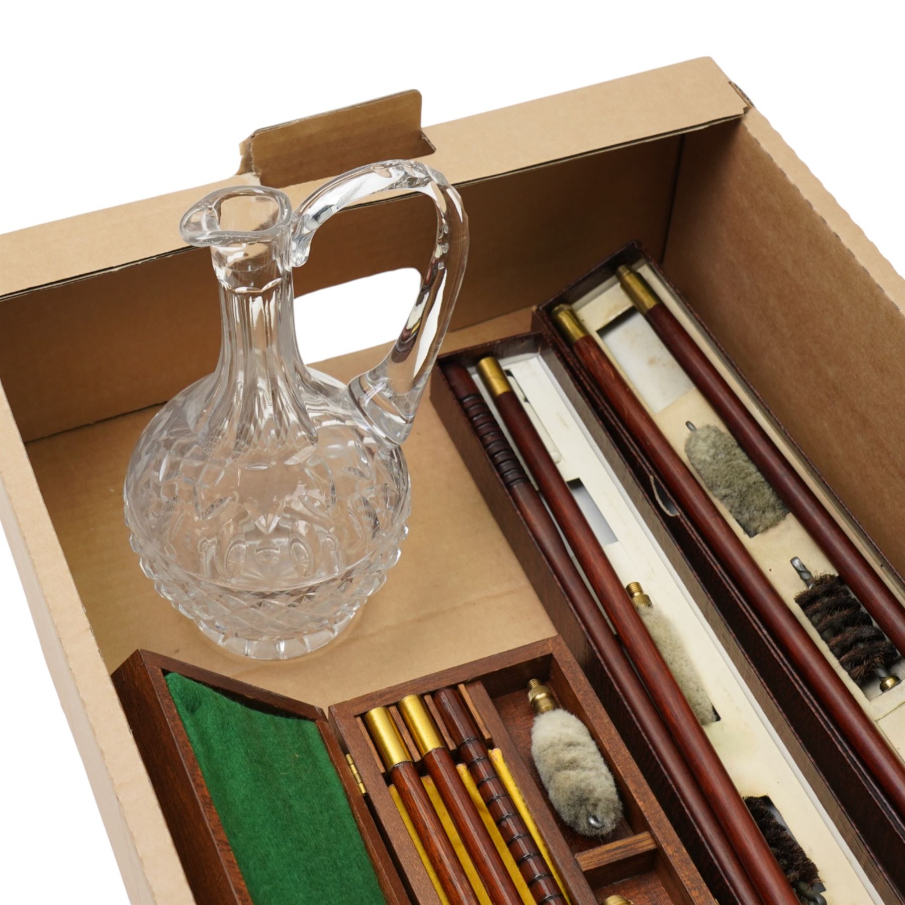 Two Parker Hale shotgun cleaning kits, another cleaning kit in wooden case and a glass jug