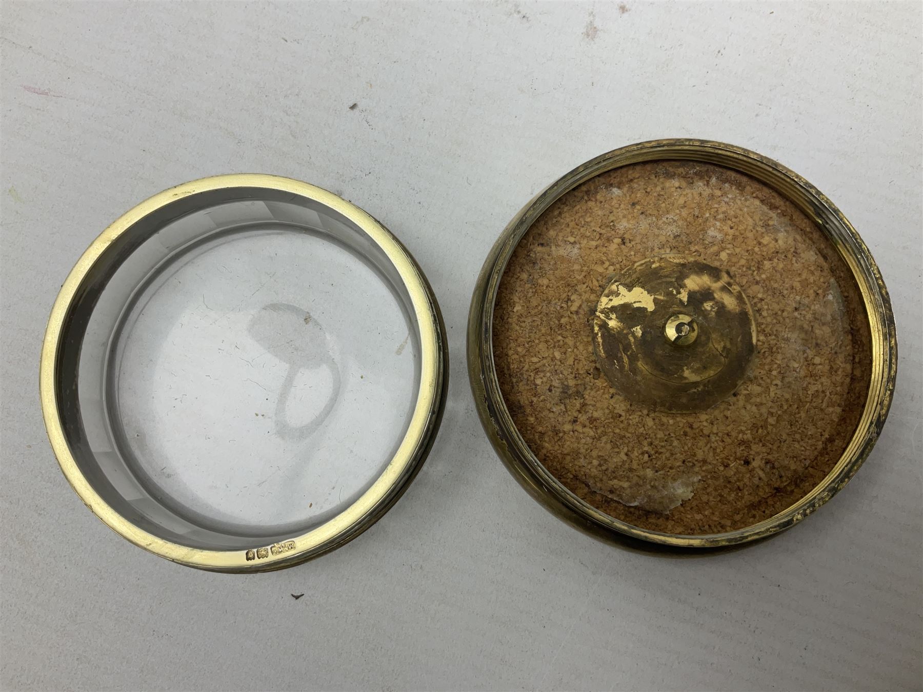 Pair of early 20th century glass dressing table jars, or circular facet cut form, with silver covers, hallmarked London, probably 1912