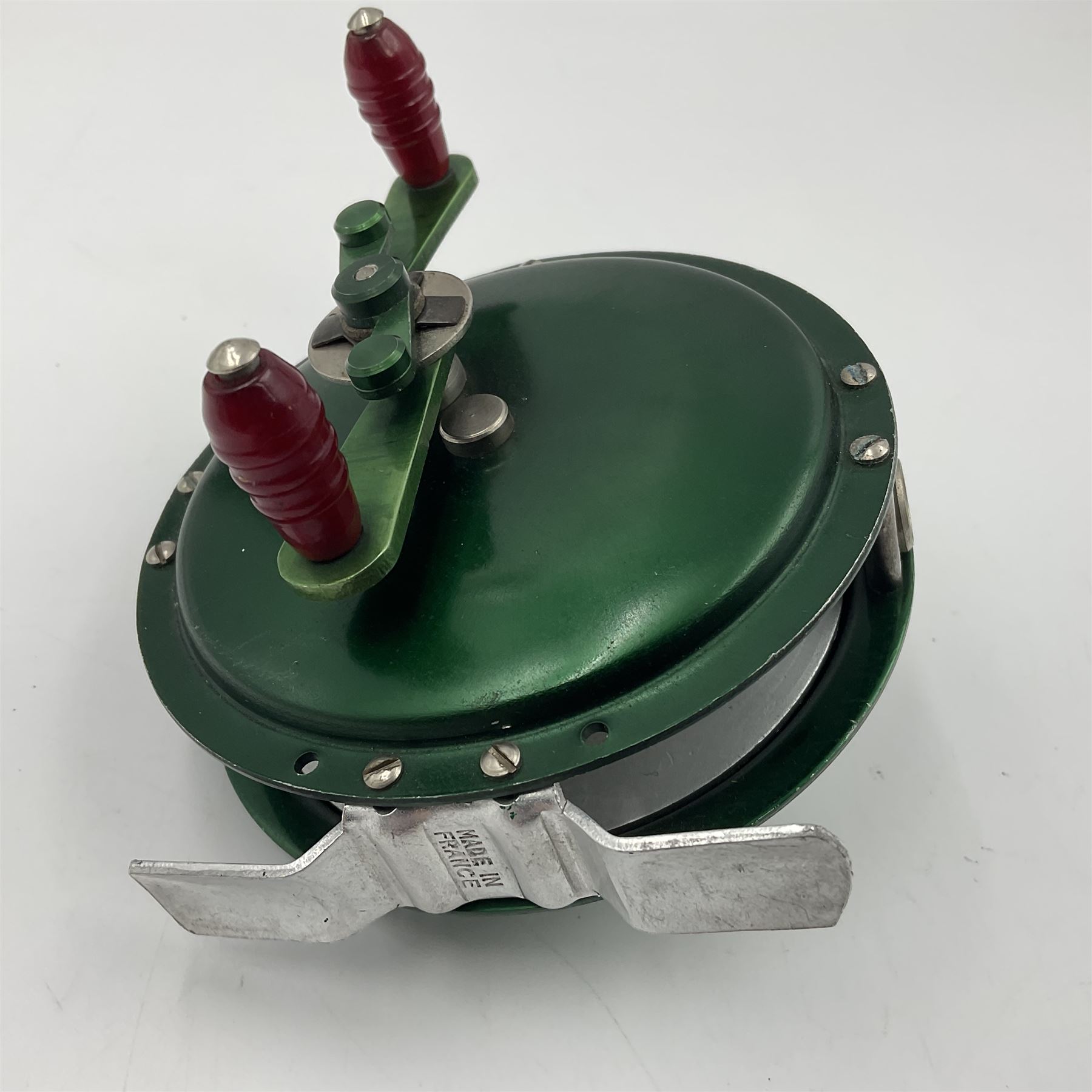 TO RTV Three fishing reels, including American Pflueger progress bulldog size 60 brass and chrome skeleton fly reel, with wooden handle; Maginot 106 fly reel and an alloy reel (3)