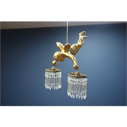  Gilt metal centre light fitting in the form of a cherub, twin branch with cut glass hanging drops, H42cm   