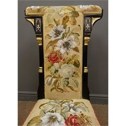  Late Victorian Aesthetic Movement Prie-dieu Chair, of Puginesque design, ebonised frame with gilt detail, upholstered in floral needle and bead work, H98cm  