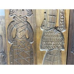 Six 20th century hardwood Dutch folk art Speculaasplank or biscuit moulds, typically carved with figures in traditional dress, largest H101cm