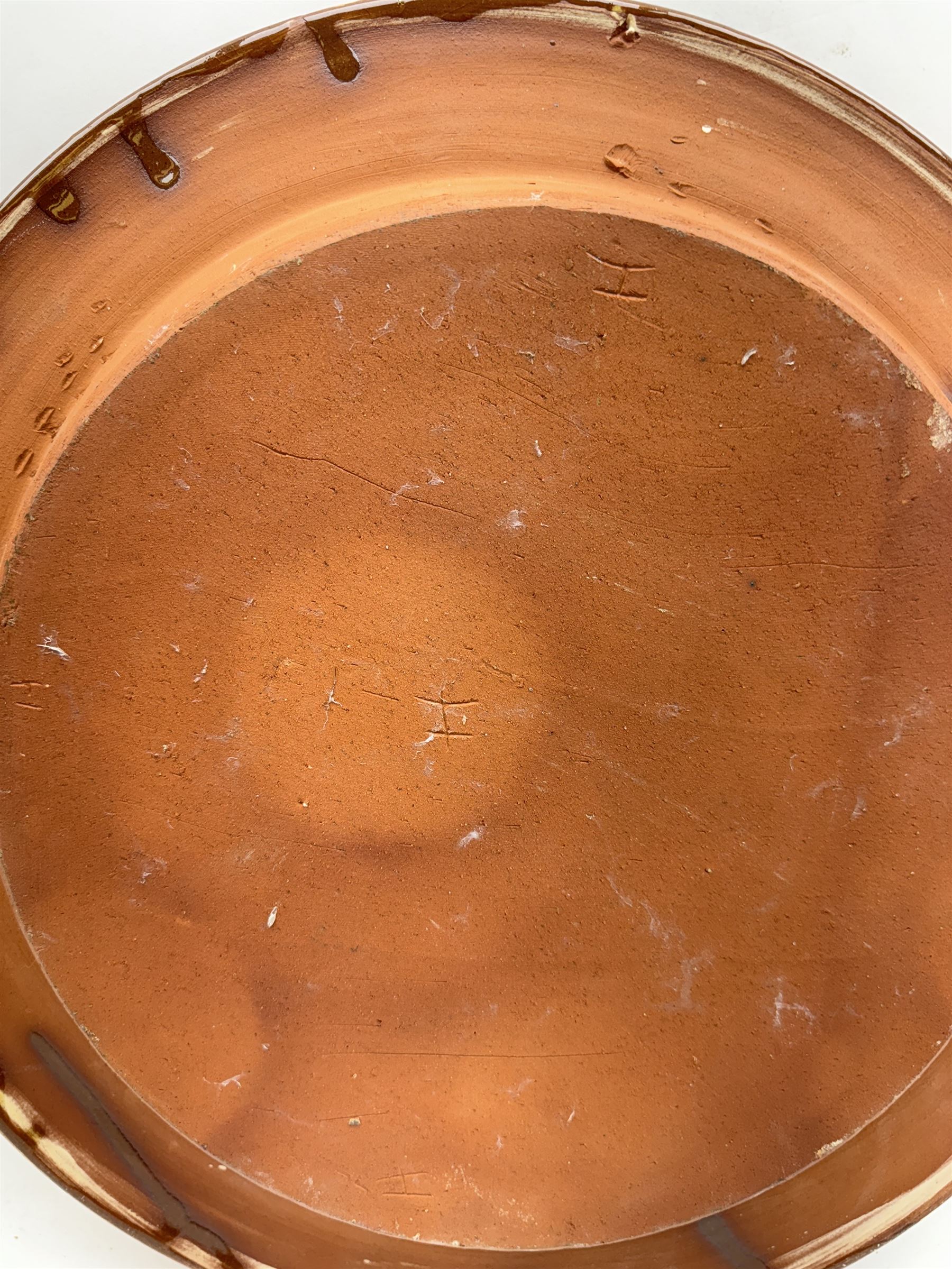 John Hudson: Large slipware charger in the style of Thomas Toft by John Hudson of Mirfield Pottery, decorated with a cockerel, incised marks verso, D 41cm.